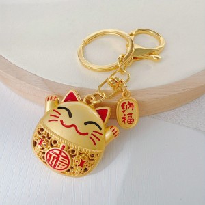 Metalowy breloczek Maneki Neko na szczęście